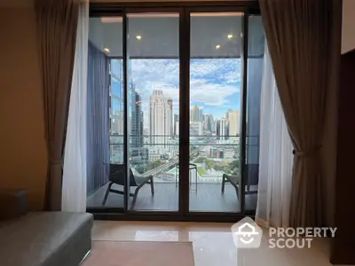 Luxurious high-rise apartment with stunning city view from spacious balcony.