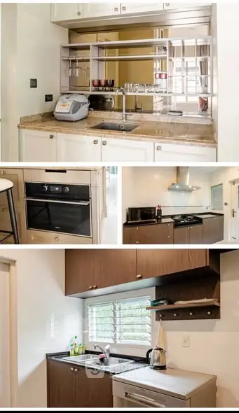 Modern kitchen with sleek appliances and stylish cabinetry, perfect for culinary enthusiasts.