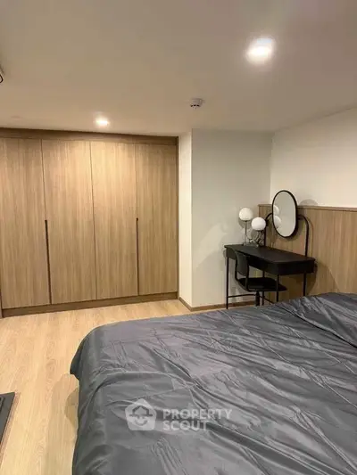 Modern bedroom with sleek wooden wardrobe and stylish vanity desk