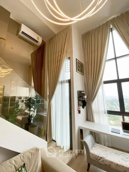 Luxurious high-ceiling living room with large windows and elegant decor in modern apartment.