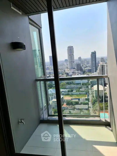 Stunning high-rise balcony with panoramic city views, perfect for urban living enthusiasts.