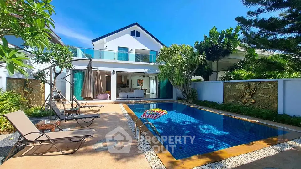 Luxurious villa with private pool and lush garden, perfect for relaxation and entertainment.