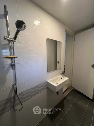 Modern bathroom with sleek shower and minimalist sink design