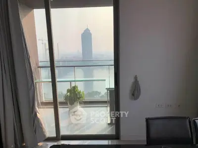Stunning high-rise apartment with balcony offering breathtaking city and river views, perfect for urban living.