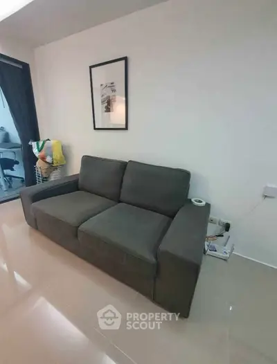 Modern living room with sleek gray sofa and stylish decor