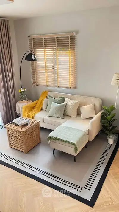 Stylish living room with cozy sofa, chic decor, and natural light