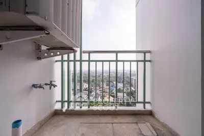 High-rise balcony with city view, perfect for enjoying the skyline and fresh air.
