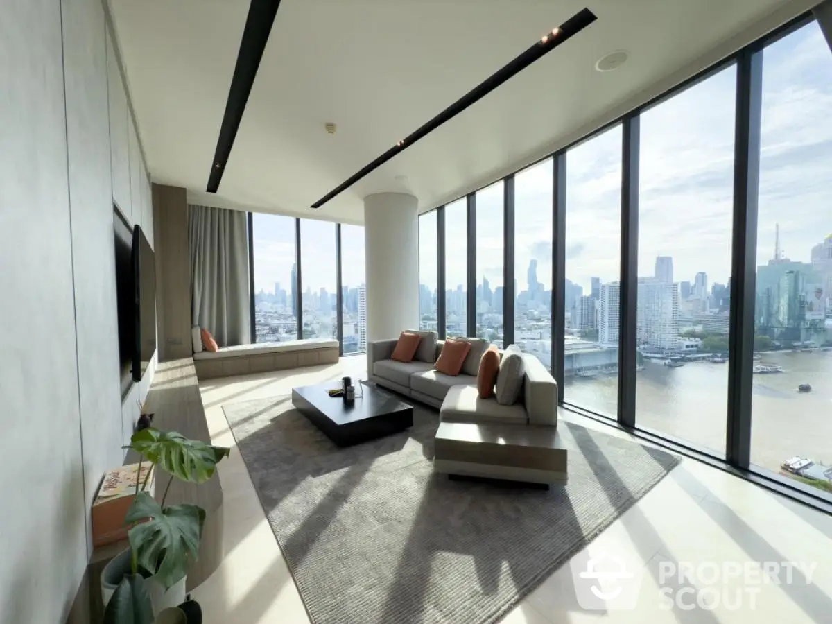 Luxurious corner unit living room with panoramic city view and modern decor