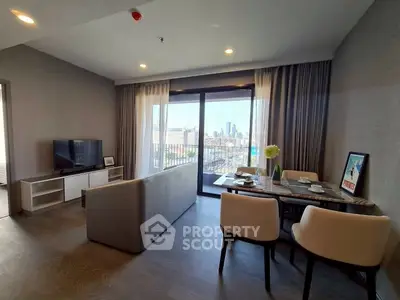 Modern living room with city view, featuring elegant dining area and cozy seating, perfect for urban living.