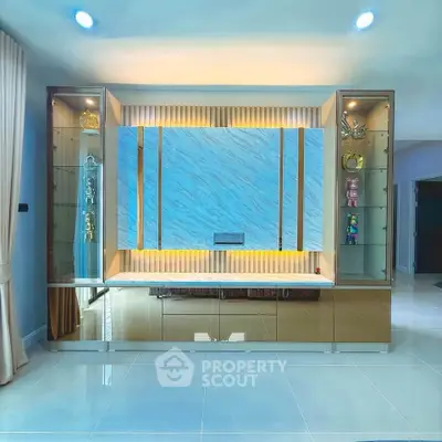 Luxurious modern living room with elegant built-in shelving and ambient lighting