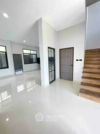 Spacious modern interior with sleek staircase and open layout