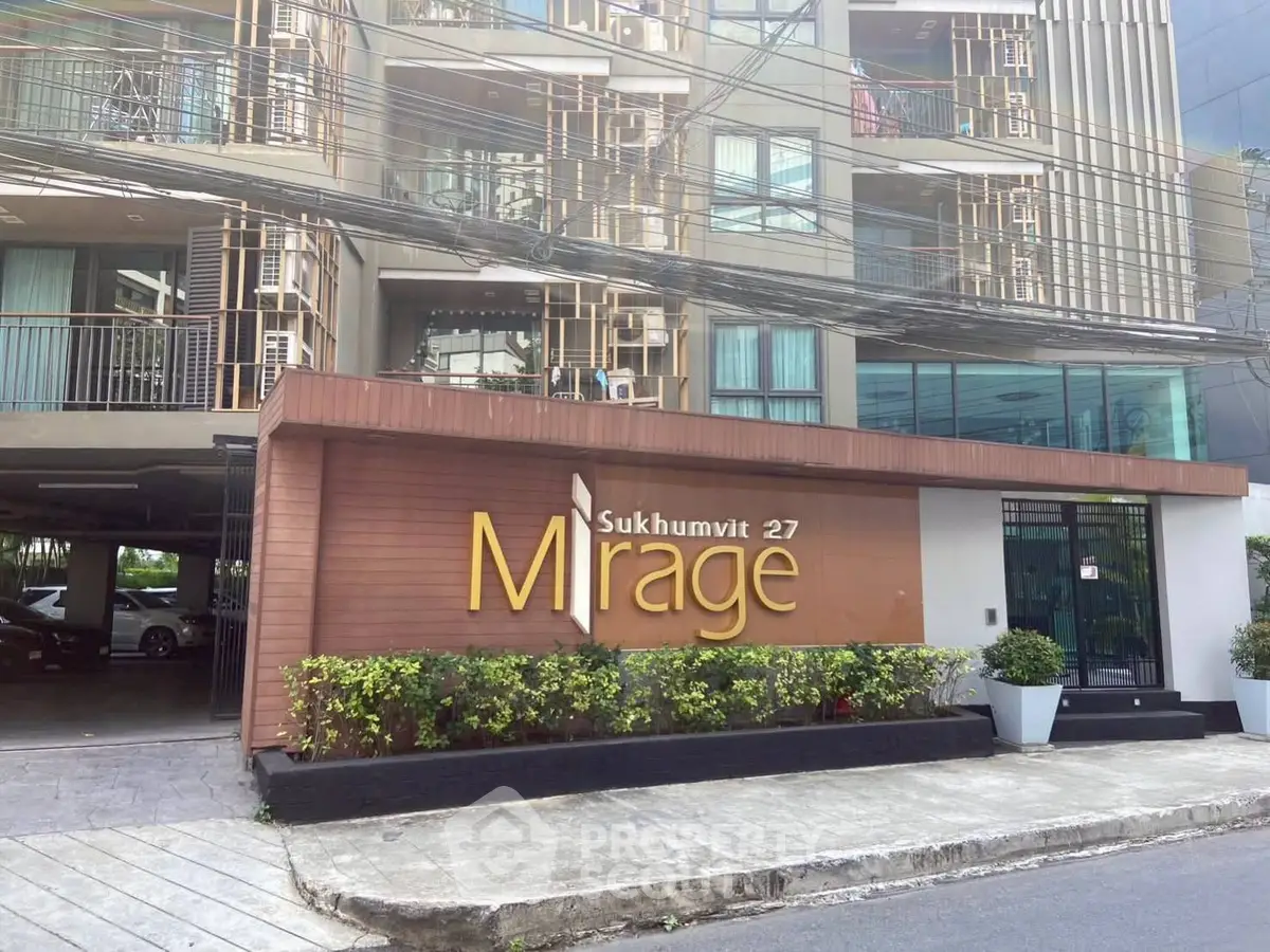 Modern apartment building exterior with stylish facade and greenery at Mirage Sukhumvit 27.
