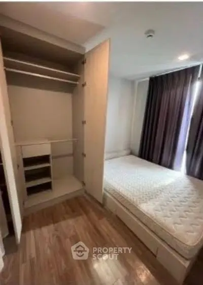 Cozy bedroom with open closet and natural light