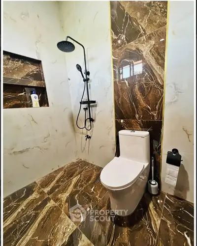 Luxurious bathroom with marble tiles and modern fixtures
