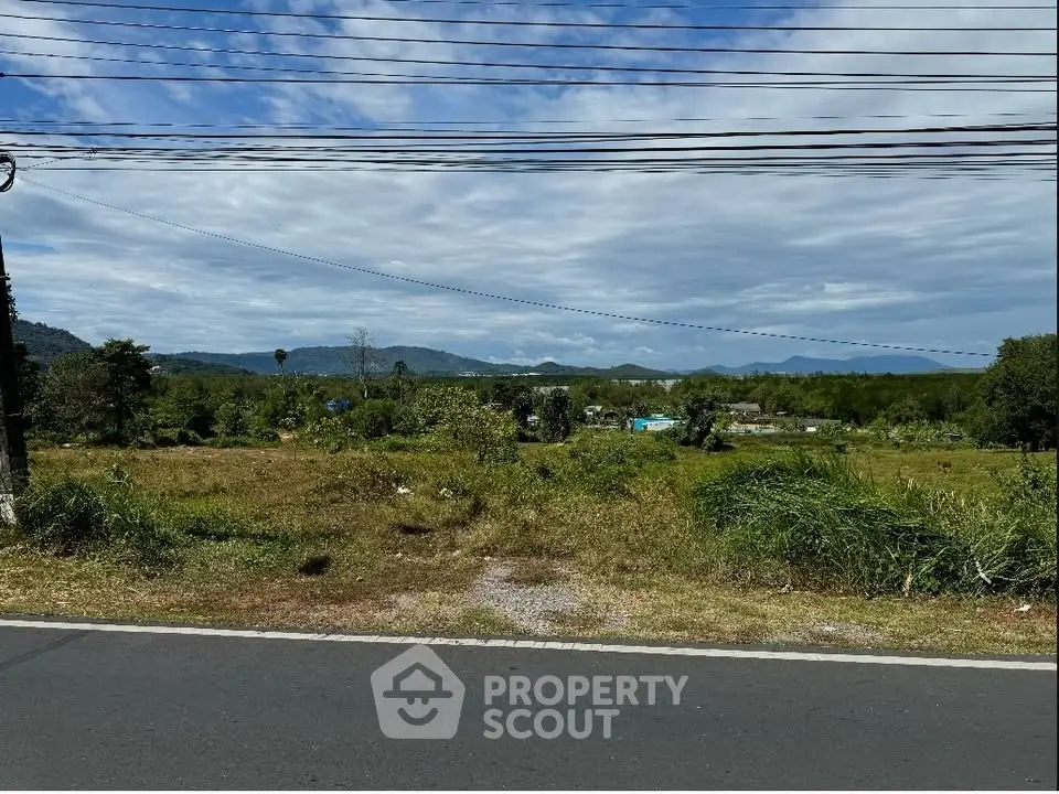 Scenic land plot with mountain views and lush greenery, ideal for development or investment.