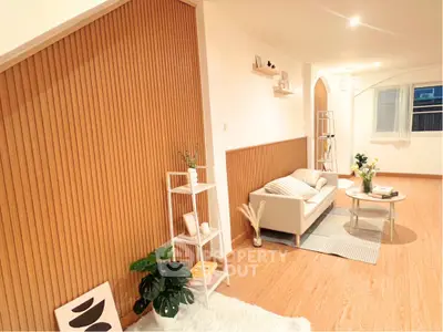 Spacious modern living room with stylish decor and wooden accents