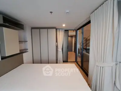 Modern bedroom with spacious layout and elegant curtains