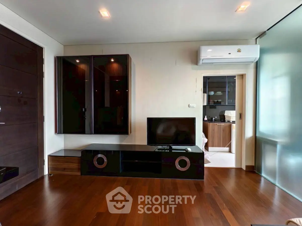 Modern living room with sleek furniture and hardwood floors