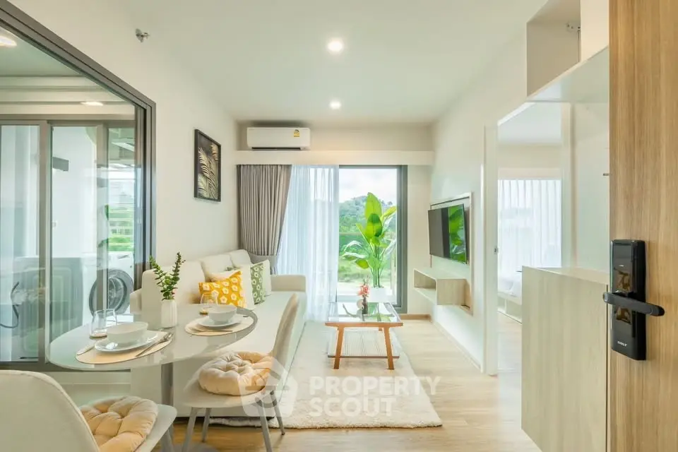 Modern living room with natural light and balcony view in a stylish apartment