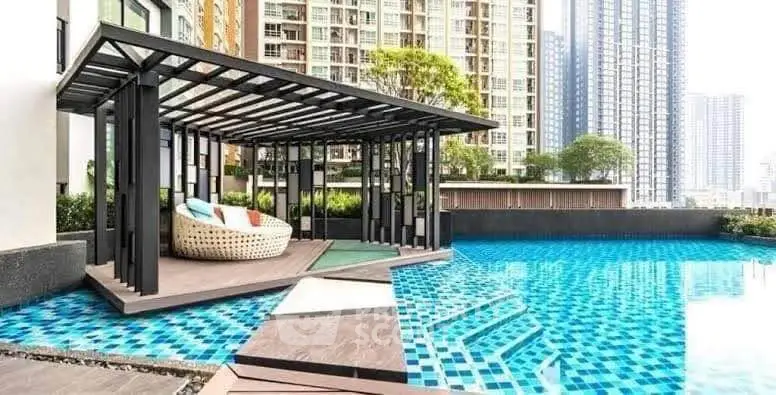 Luxurious poolside cabana with modern design in high-rise residential complex.