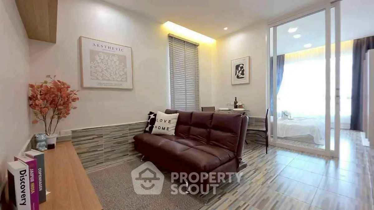 Modern living room with stylish decor and cozy seating in a contemporary apartment.