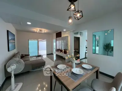 Modern living and dining area with stylish decor and natural light