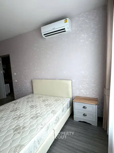 Modern bedroom with air conditioning and stylish decor