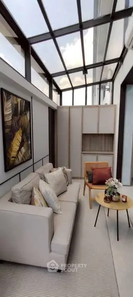 Stylish modern living room with glass ceiling and elegant decor