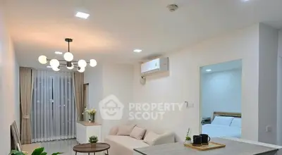 Modern living room with elegant lighting and cozy seating area