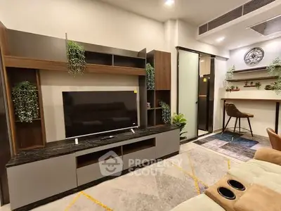 Modern living room with sleek entertainment unit and cozy seating area