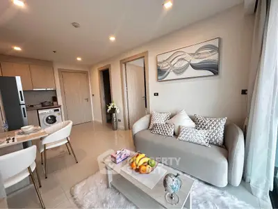 Modern living room with stylish decor and open kitchen layout