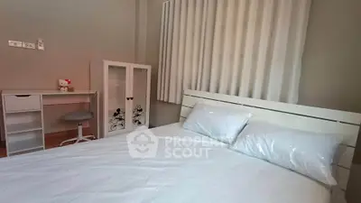 Cozy bedroom with white furniture and charming decor