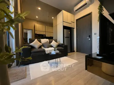 Modern living room with sleek furniture and stylish decor in a contemporary apartment.