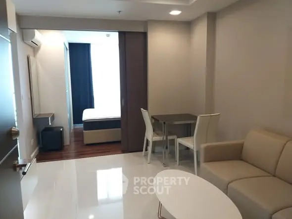 Modern apartment interior with open living room and bedroom layout