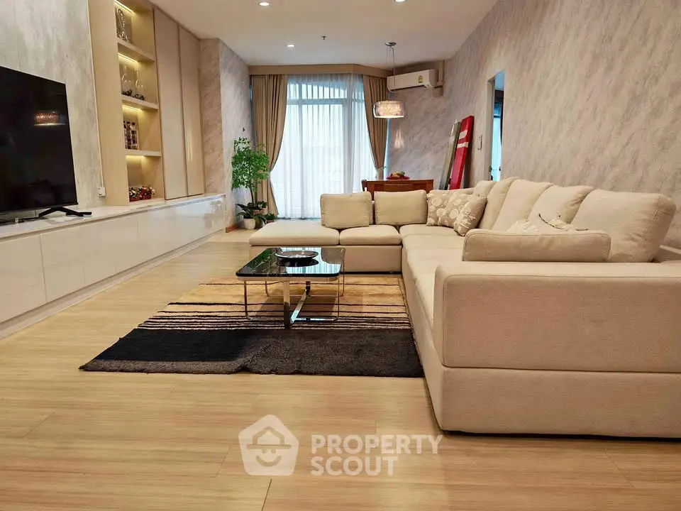 Spacious modern living room with elegant decor and large sectional sofa