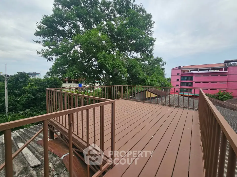 Spacious rooftop terrace with scenic views and lush greenery