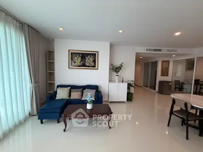 Spacious living room with elegant decor and natural light