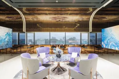 Luxurious modern living room with elegant decor and panoramic city views.