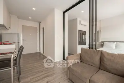 Modern apartment interior with cozy living room and adjacent bedroom