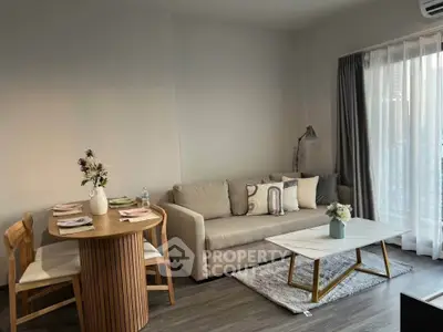 Modern living room with cozy sofa, stylish coffee table, and dining area in elegant apartment.