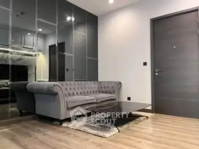 Modern living room with elegant sofa and sleek glass wall design