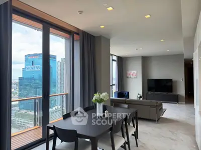 Luxurious high-rise living room with stunning city view and modern furnishings.