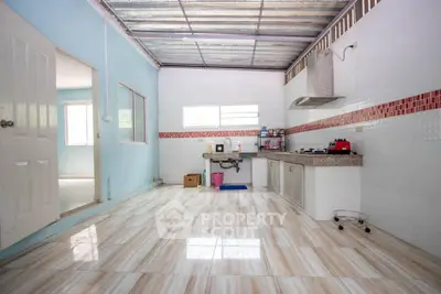 Spacious kitchen with open layout and modern gas stove