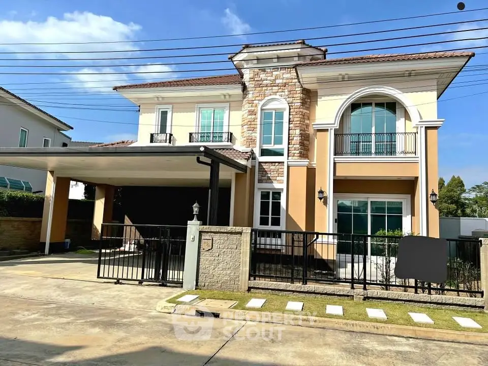Elegant two-story house with stone facade and spacious driveway