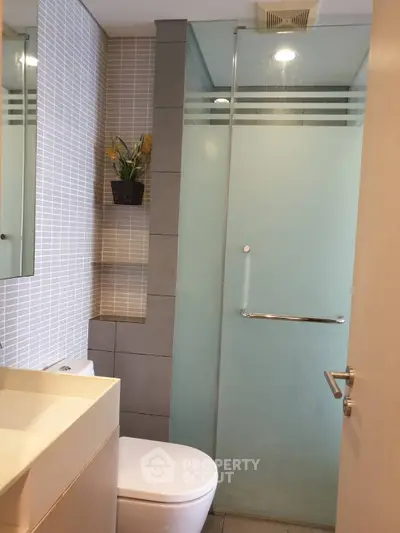 Modern bathroom with glass shower and sleek design