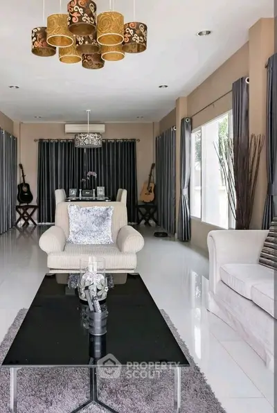 Elegant living room with modern decor and stylish lighting fixtures.