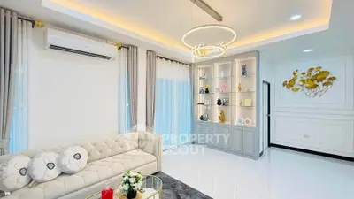 Elegant living room with modern chandelier and stylish decor