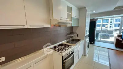 Modern kitchen with sleek appliances and open layout in a bright apartment