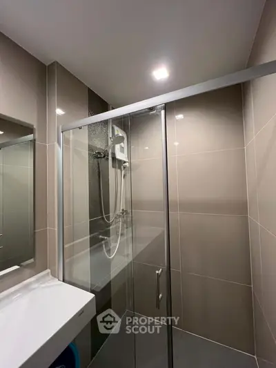Modern bathroom with sleek shower enclosure and contemporary fixtures