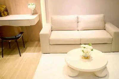 Modern living room with beige sofa, stylish coffee table, and elegant decor